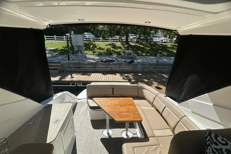  Yacht Photos Pics Interior view of 2016 Sea Ray 350 Sundancer yacht with seating and table.