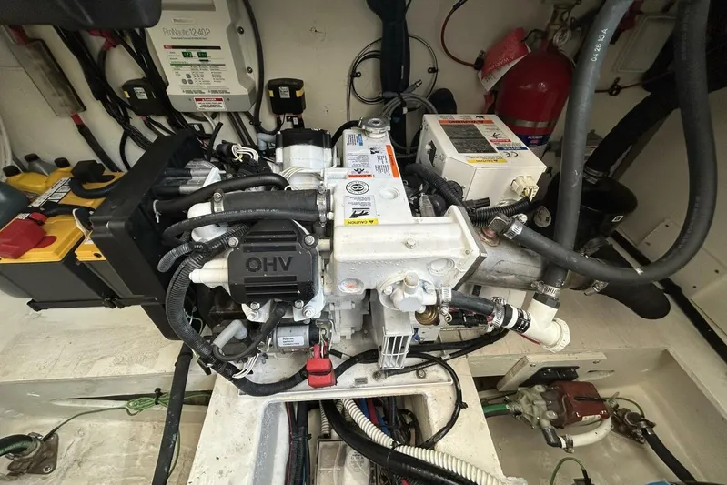  Yacht Photos Pics Engine compartment of a 2016 Sea Ray 350 Sundancer boat, showcasing mechanical components.