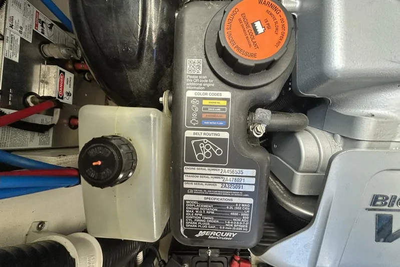  Yacht Photos Pics Engine compartment of 2016 Sea Ray 350 Sundancer with Mercury components and warning labels.