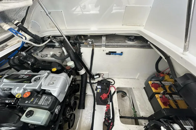  Yacht Photos Pics Engine compartment of a 2016 Sea Ray 350 Sundancer with visible batteries and wiring.