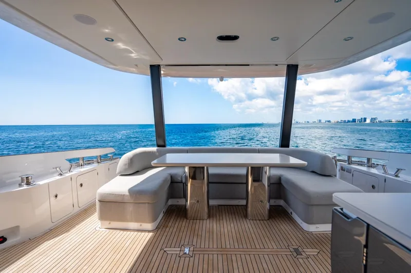 Effortless Yacht Photos Pics Luxurious 2023 Azimut Fly 68 yacht deck with ocean view and modern seating.