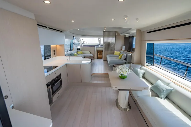 Effortless Yacht Photos Pics Luxurious interior of 2023 Azimut Fly 68 yacht with modern furnishings and ocean view.