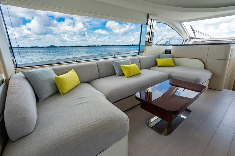 Effortless Yacht Photos Pics Luxurious interior of 2023 Azimut Fly 68 yacht with elegant seating and ocean view.