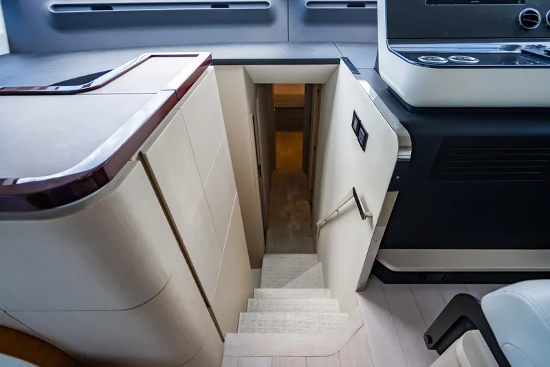 Effortless Yacht Photos Pics Interior staircase of 2023 Azimut Fly 68 yacht, featuring modern design and sleek finishes.