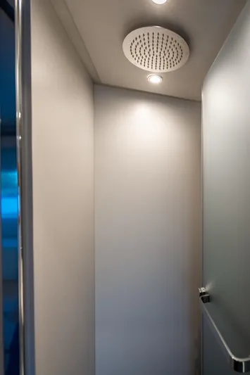 Effortless Yacht Photos Pics Shower area in 2023 Azimut Fly 68 yacht, featuring modern lighting and sleek design.