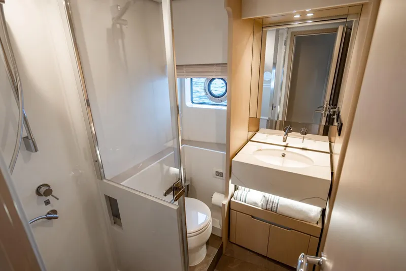 Effortless Yacht Photos Pics Luxurious bathroom in 2023 Azimut Fly 68 yacht, featuring modern fixtures and elegant design.