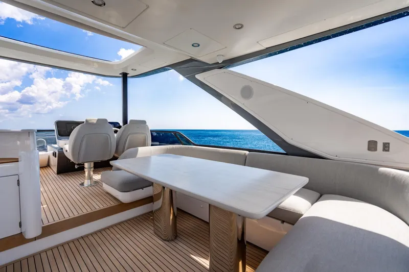 Effortless Yacht Photos Pics Luxurious 2023 Azimut Fly 68 yacht interior with elegant seating and ocean view.