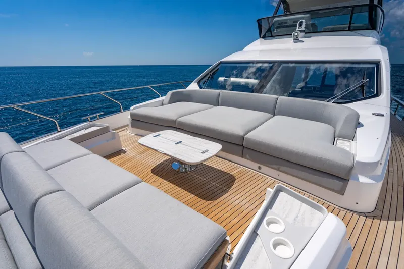 Effortless Yacht Photos Pics Luxurious 2023 Azimut Fly 68 yacht deck with elegant seating and ocean view.