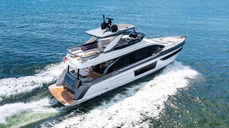 Effortless Yacht Photos Pics 2023 Azimut Fly 68 yacht cruising on open water, showcasing sleek design and luxury features.