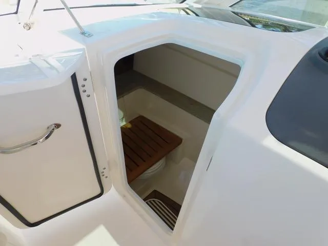  Yacht Photos Pics 2016 Boston Whaler 320 Vantage boat interior with open storage compartment.