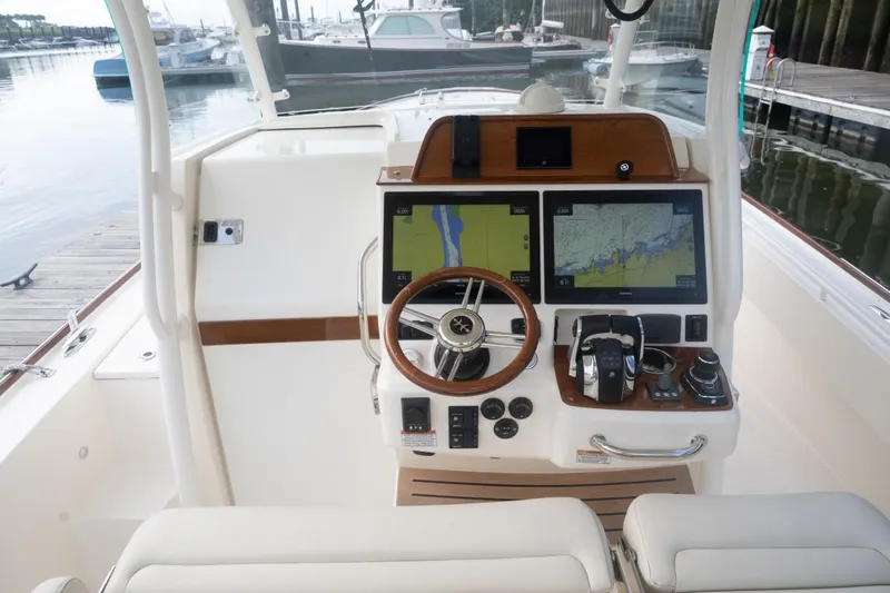 Malihini Yacht Photos Pics 2019 Hunt Yachts 32 Center Console helm with dual navigation screens and steering wheel.
