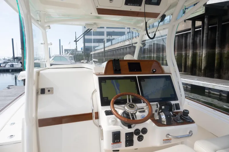 Malihini Yacht Photos Pics 2019 Hunt Yachts 32 Center Console helm with dual screens and controls at marina.