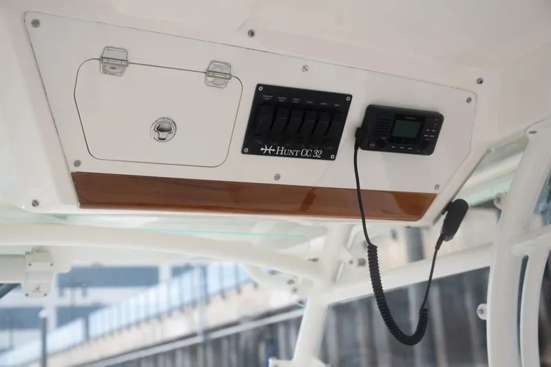 Malihini Yacht Photos Pics 2019 Hunt Yachts 32 Center Console dashboard with controls and radio equipment.