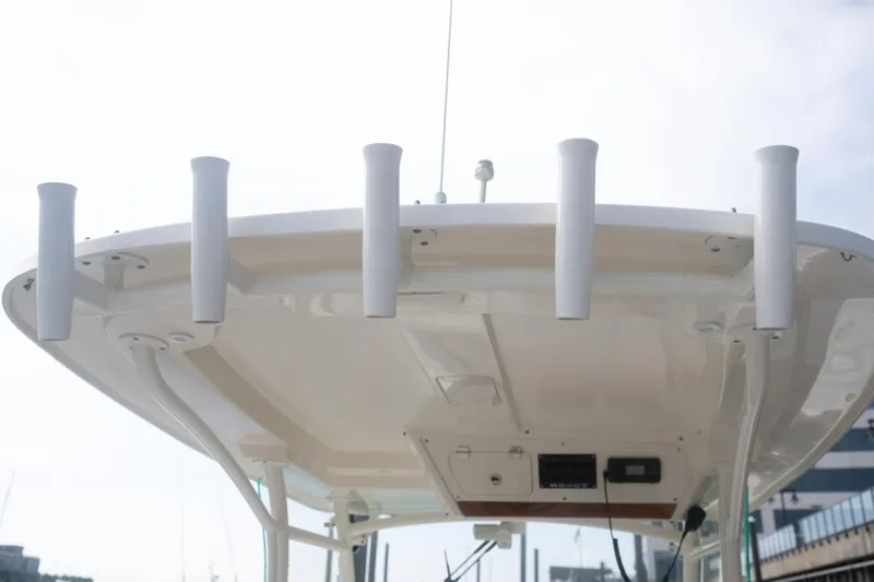 Malihini Yacht Photos Pics 2019 Hunt Yachts 32 Center Console boat roof with rod holders and electronics.