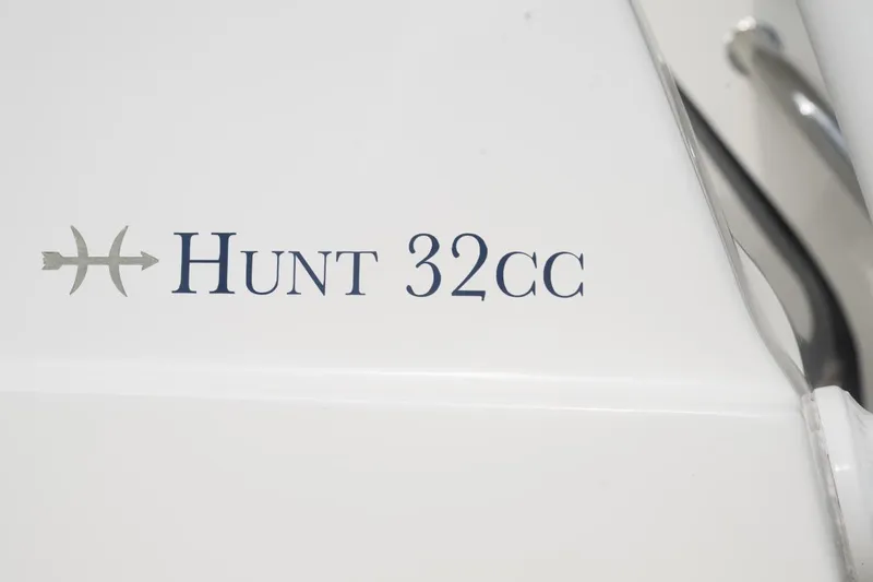 Malihini Yacht Photos Pics Hunt Yachts 32 Center Console 2019 logo on white surface.