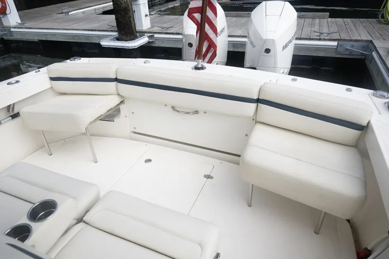Malihini Yacht Photos Pics 2019 Hunt Yachts 32 Center Console, white seating area, docked with twin Mercury engines.