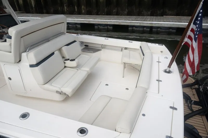 Malihini Yacht Photos Pics 2019 Hunt Yachts 32 Center Console with white seating and American flag.
