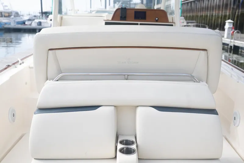 Malihini Yacht Photos Pics 2019 Hunt Yachts 32 Center Console, featuring luxurious white seating and cup holders.