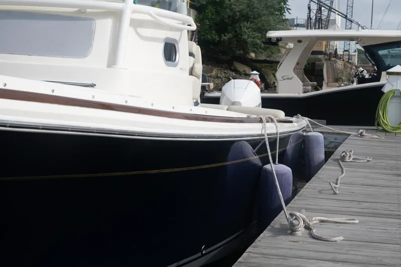 Malihini Yacht Photos Pics 2019 Hunt Yachts 32 Center Console docked with fenders and ropes.