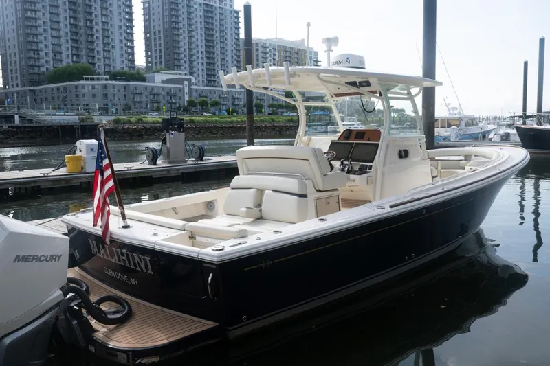 Malihini Yacht Photos Pics 2019 Hunt Yachts 32 Center Console docked, featuring sleek design and modern amenities.