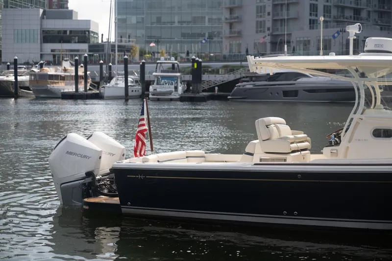 Malihini Yacht Photos Pics 2019 Hunt Yachts 32 Center Console docked in marina, featuring Mercury outboard engines.