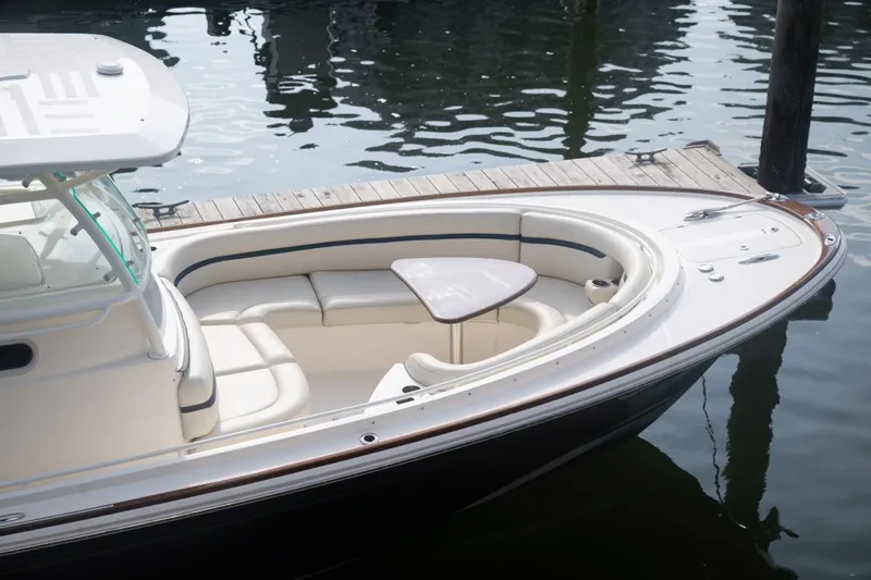 Malihini Yacht Photos Pics 2019 Hunt Yachts 32 Center Console docked, featuring sleek design and comfortable seating.
