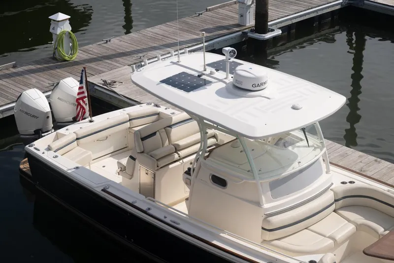 Malihini Yacht Photos Pics 2019 Hunt Yachts 32 Center Console docked, featuring dual Mercury engines and sleek design.