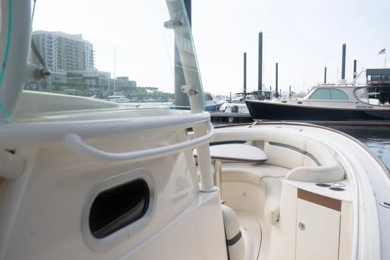 Malihini Yacht Photos Pics 2019 Hunt Yachts 32 Center Console at marina, featuring sleek design and comfortable seating.