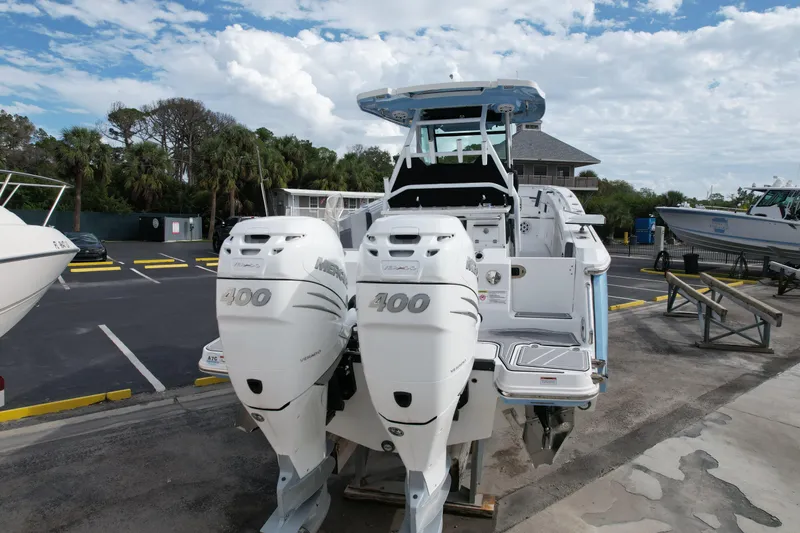  Yacht Photos Pics 2023 Blackfin 332 CC boat with twin 400 horsepower engines, parked outdoors.