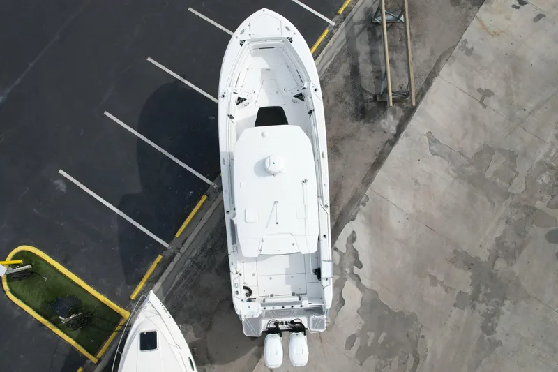  Yacht Photos Pics Aerial view of 2023 Blackfin 332 CC boat in parking lot.