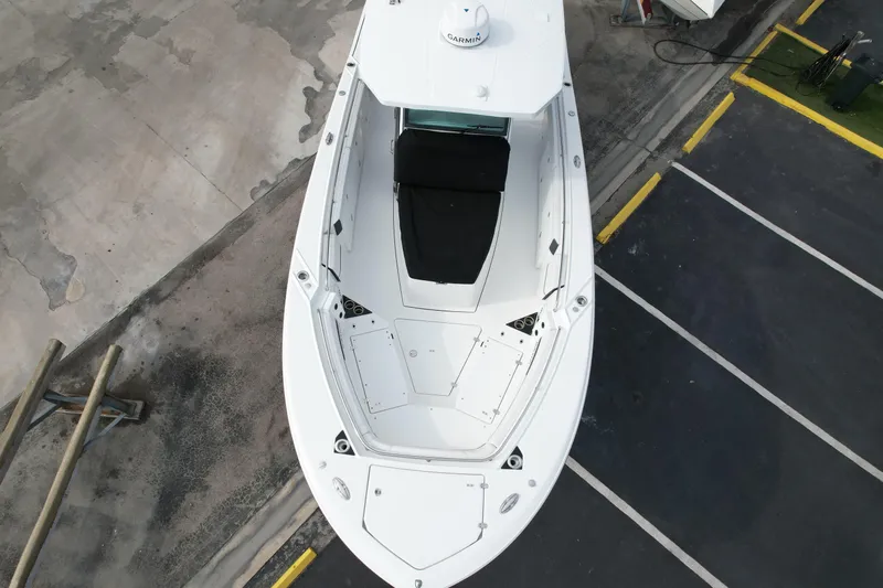  Yacht Photos Pics 2023 Blackfin 332 CC boat, aerial view, docked on concrete surface.