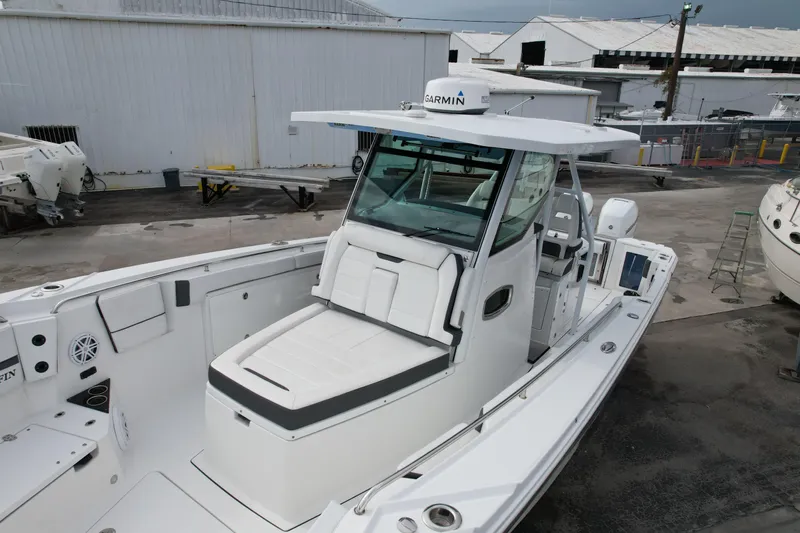  Yacht Photos Pics 2023 Blackfin 332 CC boat with Garmin equipment, docked in a marina.