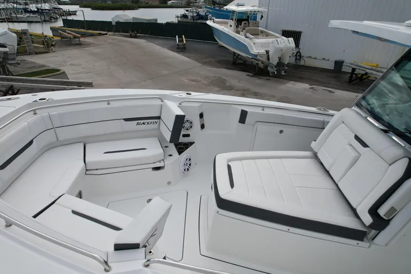  Yacht Photos Pics 2023 Blackfin 332 CC boat interior with white seating and modern design.