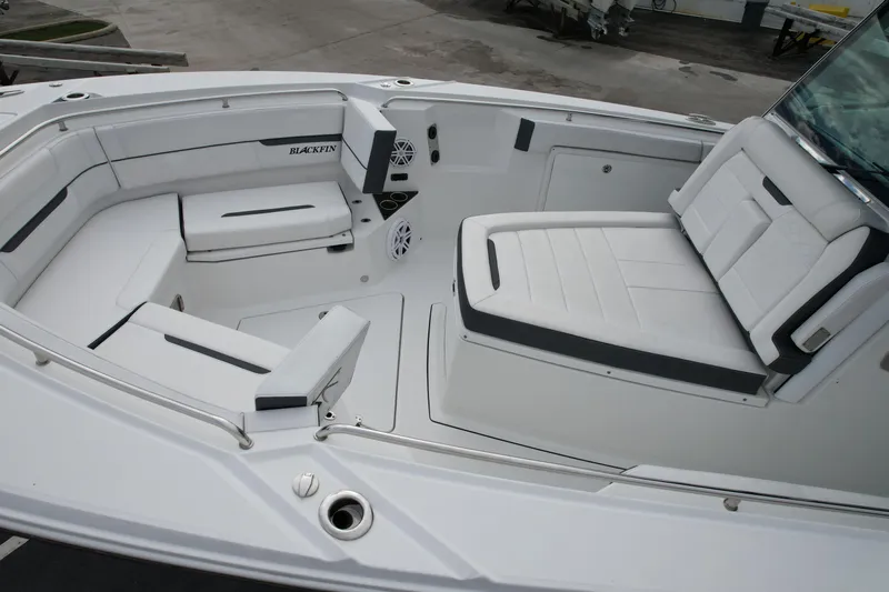  Yacht Photos Pics 2023 Blackfin 332 CC boat interior with white seating and modern design.