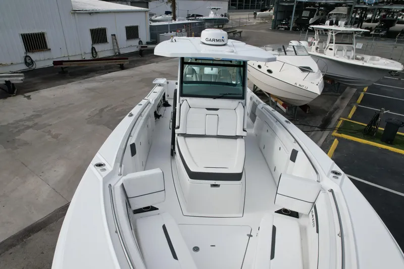  Yacht Photos Pics 2023 Blackfin 332 CC boat with spacious deck and modern design in a marina setting.