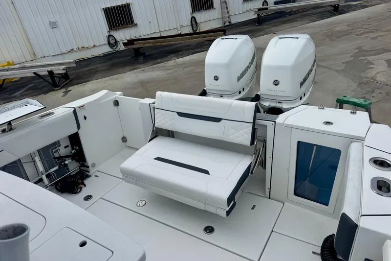  Yacht Photos Pics 2023 Blackfin 332 CC boat with dual Mercury engines and foldable seating.