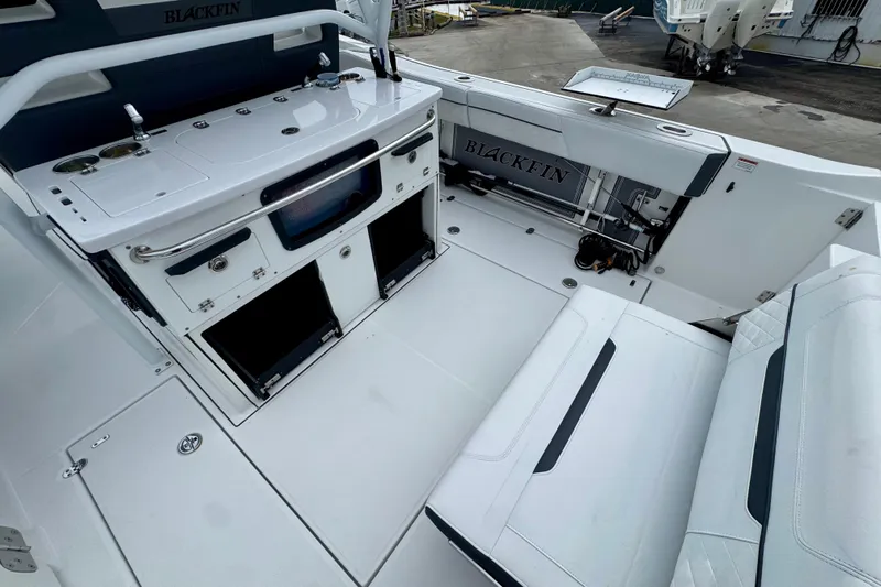 Yacht Photos Pics 2023 Blackfin 332 CC boat interior with seating and storage compartments.