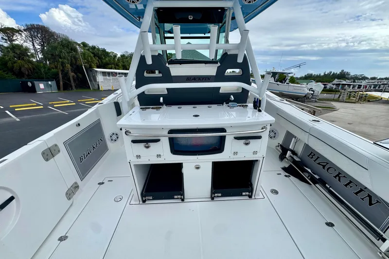  Yacht Photos Pics 2023 Blackfin 332 CC boat interior with fishing station and storage compartments.