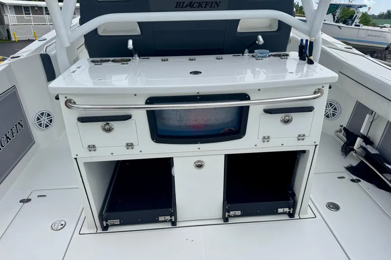  Yacht Photos Pics 2023 Blackfin 332 CC boat interior with storage compartments and fishing station.