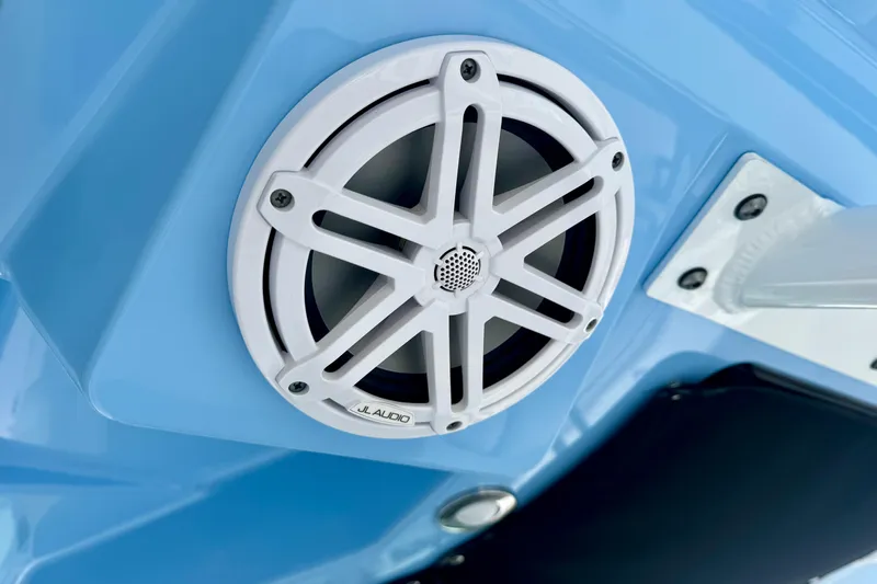  Yacht Photos Pics White JL Audio speaker on 2023 Blackfin 332 CC boat, mounted on blue surface.