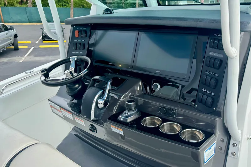  Yacht Photos Pics 2023 Blackfin 332 CC helm with dual screens and modern controls.