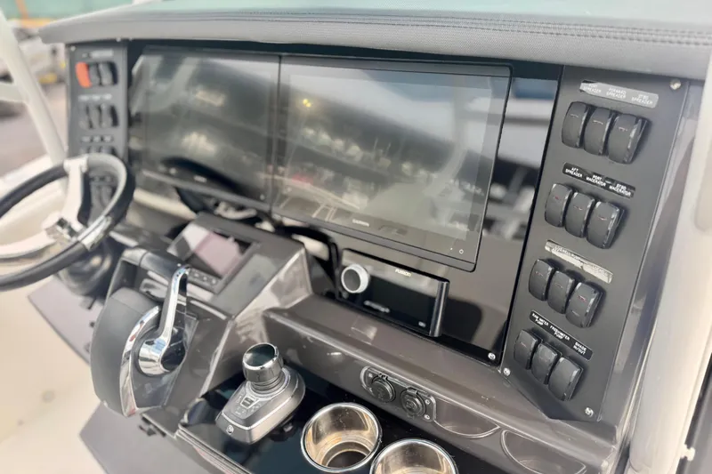  Yacht Photos Pics 2023 Blackfin 332 CC boat dashboard with advanced controls and touchscreen display.