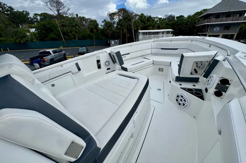  Yacht Photos Pics 2023 Blackfin 332 CC boat interior with white seating and speakers.