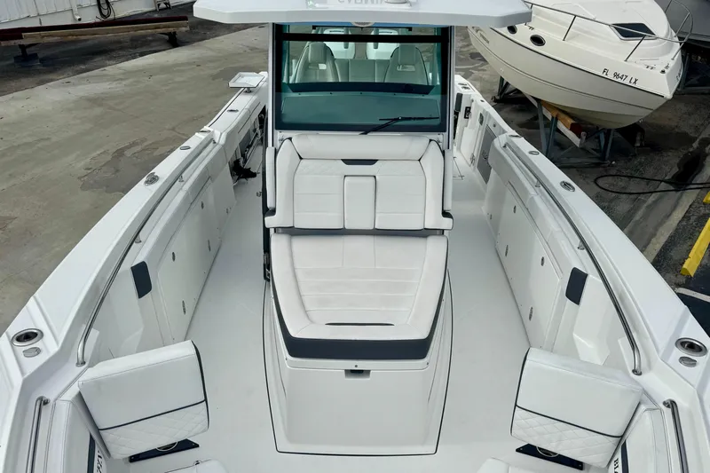  Yacht Photos Pics 2023 Blackfin 332 CC boat interior with white seating and spacious deck layout.