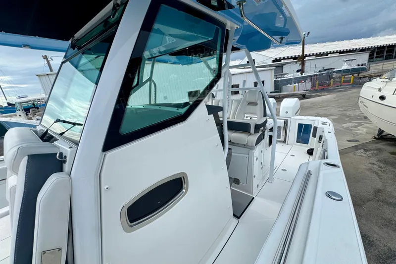  Yacht Photos Pics 2023 Blackfin 332 CC boat with sleek design and modern cockpit features.