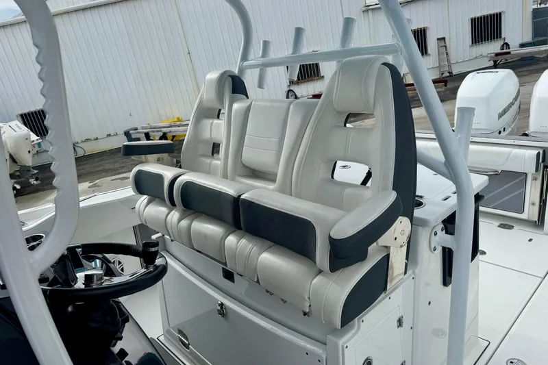  Yacht Photos Pics 2023 Blackfin 332 CC boat interior with dual captain's chairs and steering wheel.