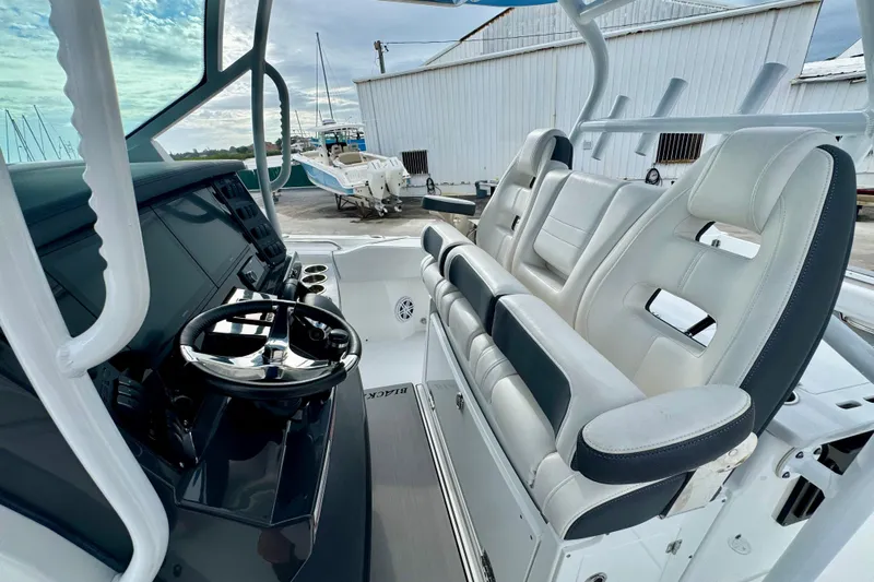  Yacht Photos Pics 2023 Blackfin 332 CC boat interior with modern helm and seating.