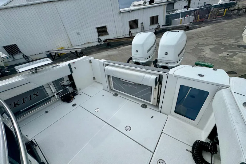  Yacht Photos Pics 2023 Blackfin 332 CC boat with dual Mercury engines at a dock.