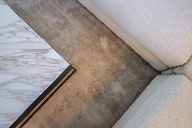 Blue Angel Yacht Photos Pics Luxurious interior of 2021 Sanlorenzo SL 120 ASYMMETRIC yacht with marble table and plush seating.