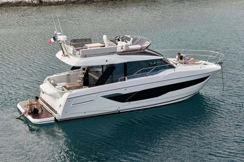  Yacht Photos Pics Manufacturer Provided Image: Luxury 2026 Prestige F4.3 yacht on serene water, featuring sunbathing deck and modern design.